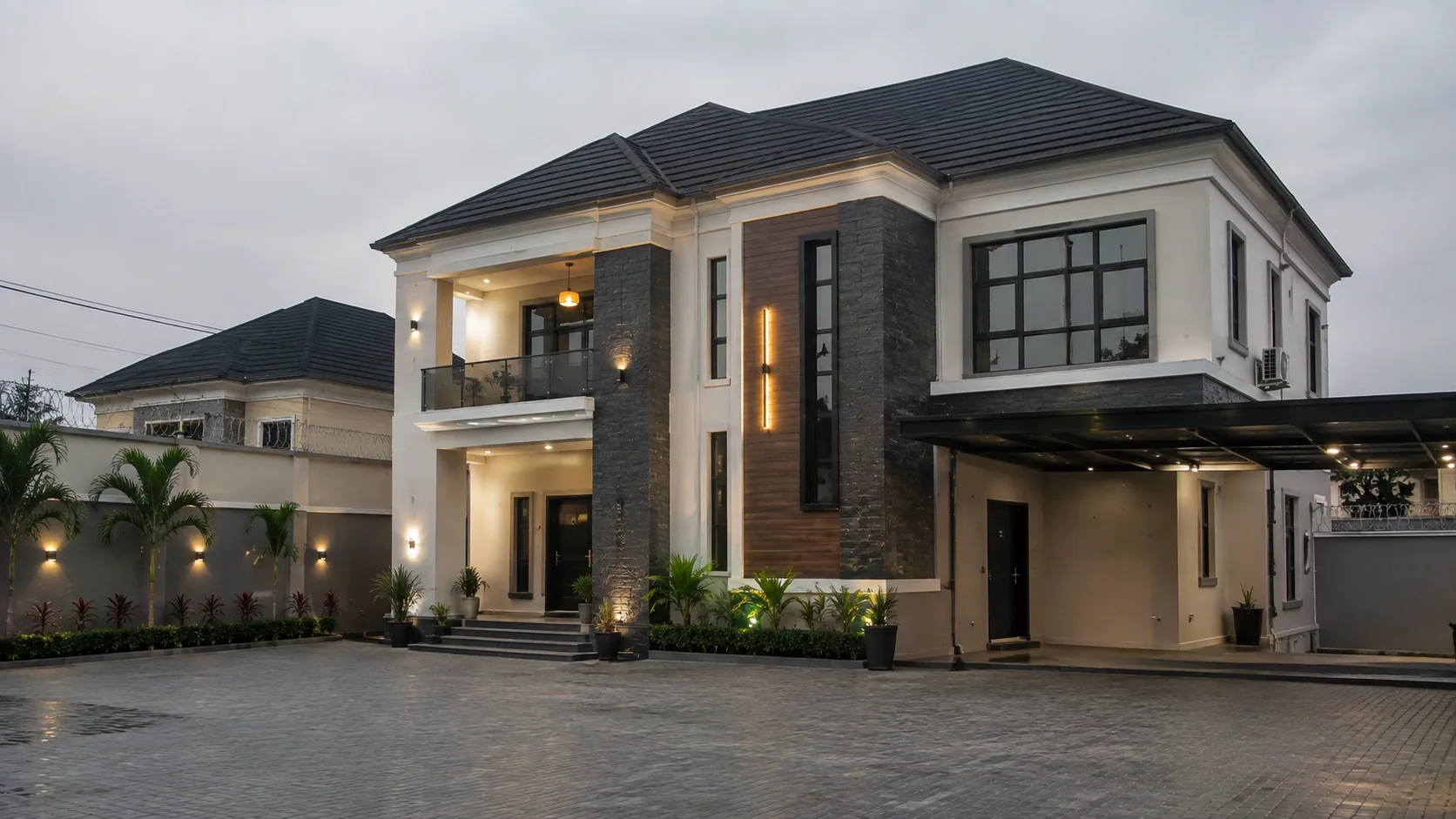 Completed contemporary two-storey residence with stone cladding and covered parking