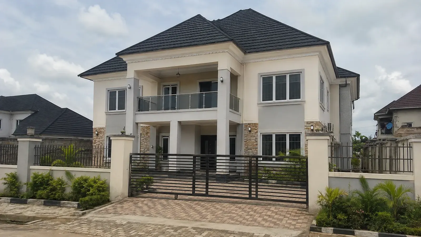 Completed two-storey residence with perimeter fencing and landscaping